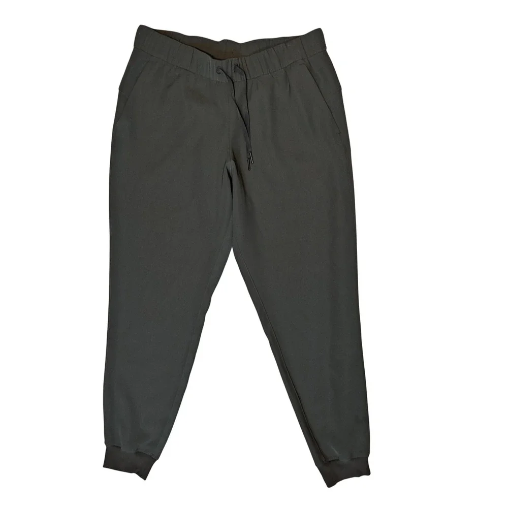 Lululemon On the Fly Jogger Women 10 Green Woven Tapered Pant Drawstring Pocket